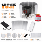 Tela corta vento dobrável em alumínio posicionada ao redor de fogareiro para uso outdoor.